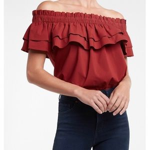 Express Elastic off the shoulder 
Ruffle overlay; Short cap sleeves
